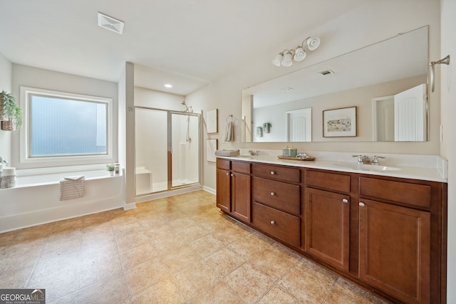 bathroom featuring vanity and separate shower and tub