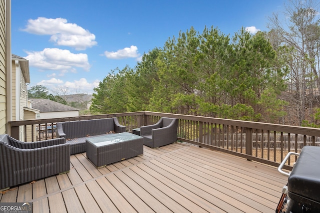 wooden terrace featuring an outdoor living space