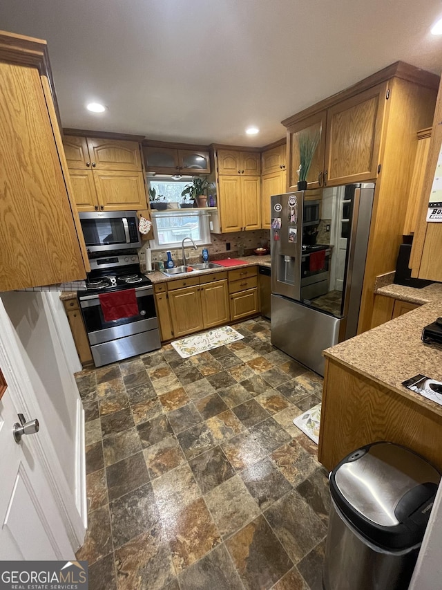 kitchen featuring appliances with stainless steel finishes and sink