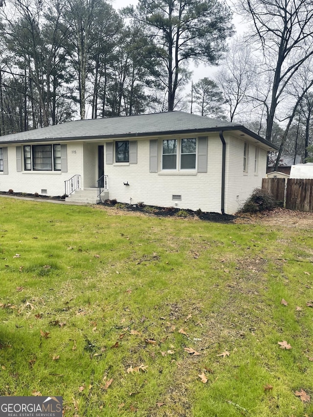 ranch-style house with a front yard