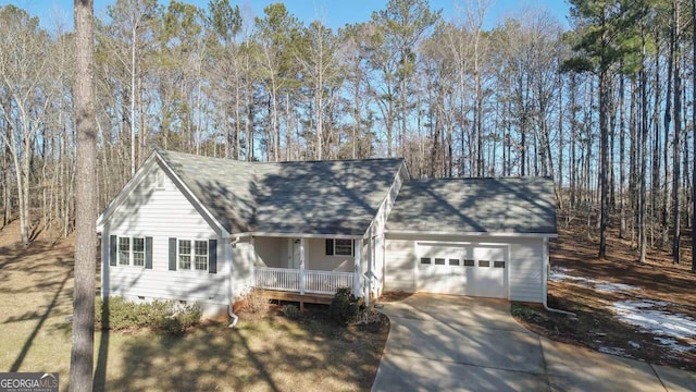 view of front of house with a garage and covered porch