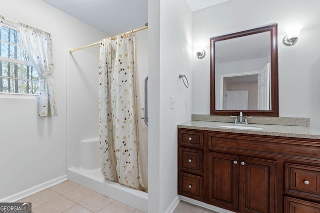 bathroom featuring tile patterned flooring, vanity, and a shower with curtain