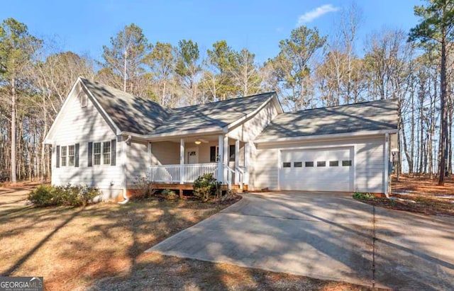 ranch-style home featuring a garage and covered porch