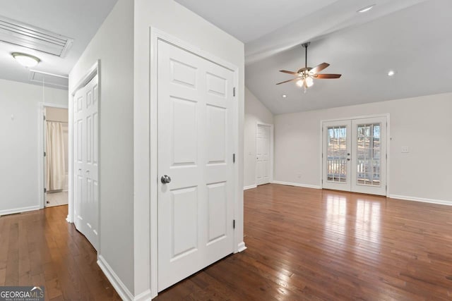 interior space featuring vaulted ceiling with beams, dark wood-type flooring, and ceiling fan