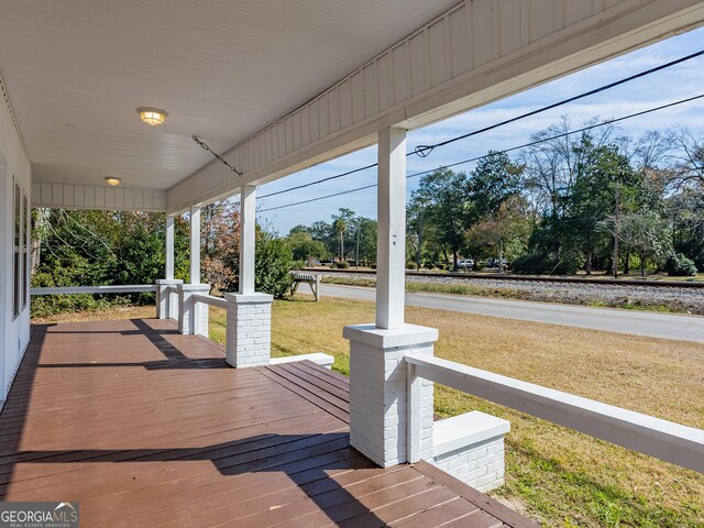424 NW Central Ave, Blackshear, GA 31516 - back of property featuring a fenced backyard, a lawn, entry steps, and metal roof