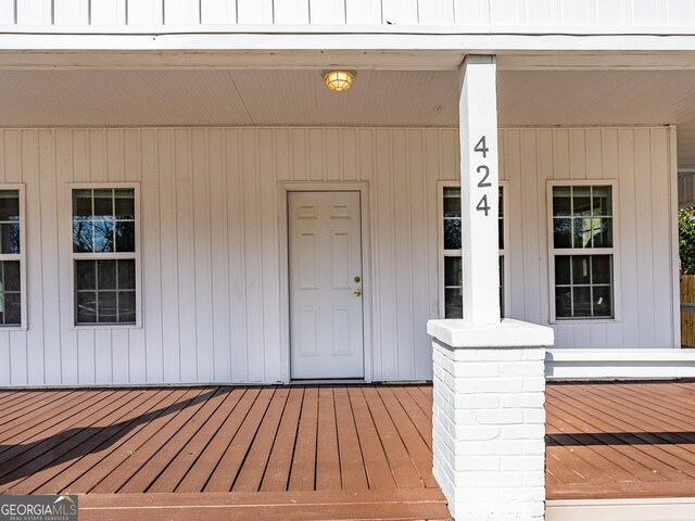424 NW Central Ave, Blackshear, GA 31516 - wooden deck featuring covered porch and a yard
