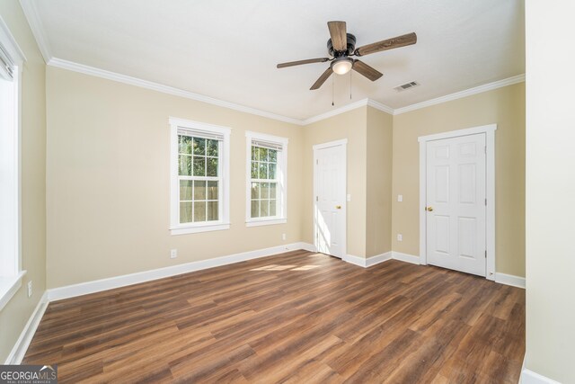 424 NW Central Ave, Blackshear, GA 31516 - kitchen with a sink, crown molding, white cabinets, and decorative light fixtures