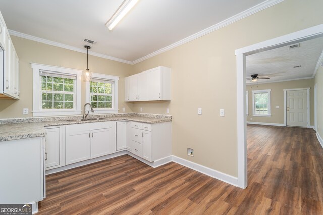 424 NW Central Ave, Blackshear, GA 31516 - utility room featuring water heater and visible vents