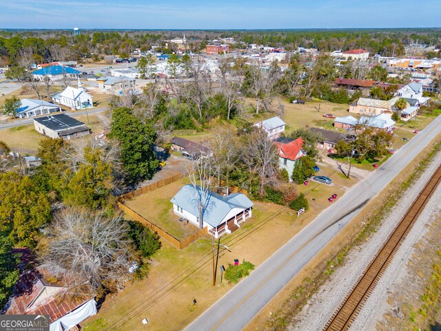 424 NW Central Ave, Blackshear, GA 31516 - full bath with vanity, ornamental molding, wood finished floors, toilet, and shower / bathing tub combination