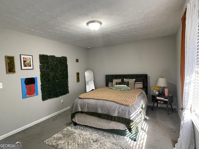 carpeted bedroom featuring a textured ceiling