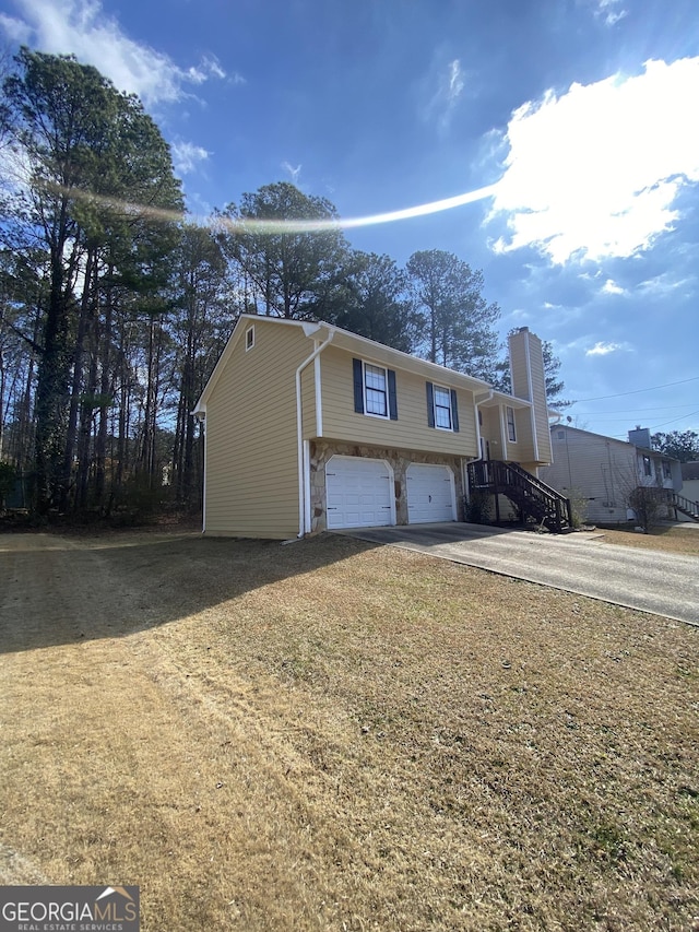 raised ranch featuring a garage