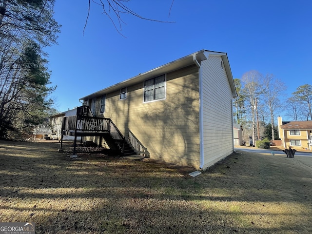 rear view of property featuring a yard