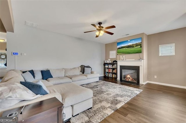 living room with hardwood / wood-style floors and ceiling fan