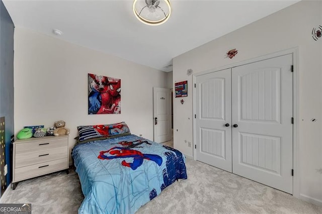 bedroom featuring a closet and light carpet