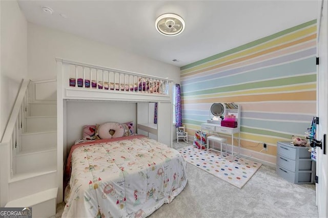 bedroom featuring light carpet