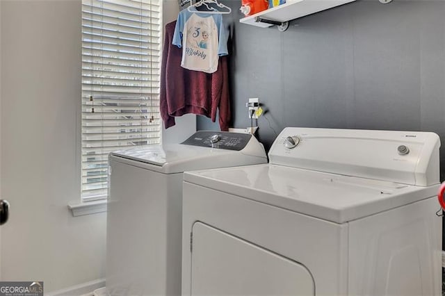 laundry room with washing machine and clothes dryer