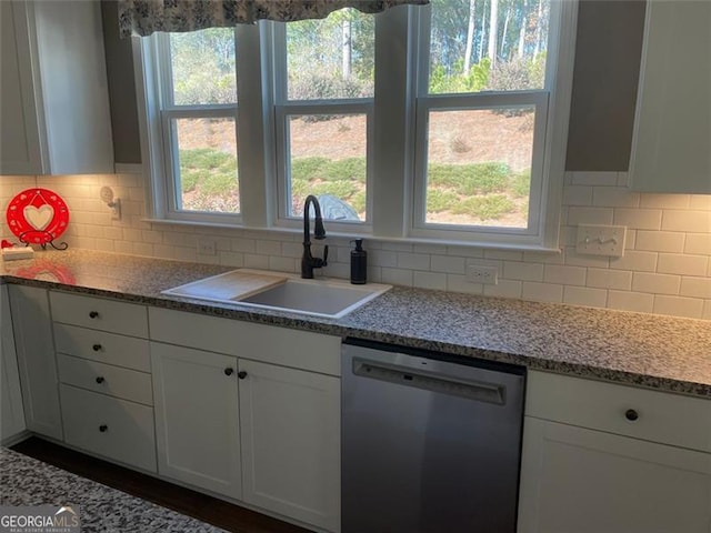 kitchen with sink, tasteful backsplash, stone countertops, dishwasher, and white cabinets