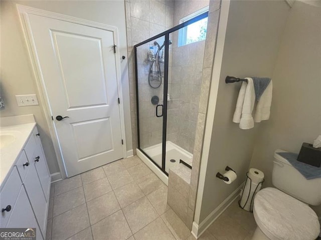 bathroom featuring vanity, toilet, tile patterned floors, and walk in shower