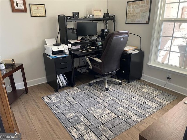 office space with wood-type flooring