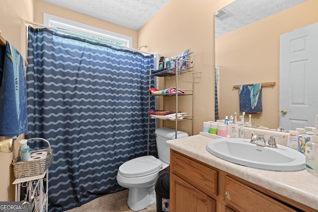 bathroom with tile patterned flooring, vanity, toilet, a textured ceiling, and a shower with curtain