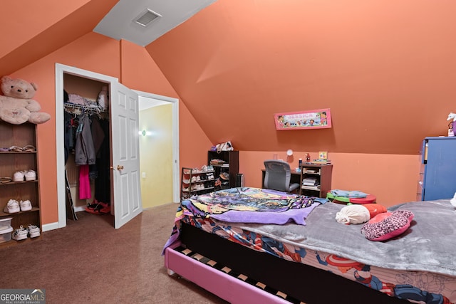 bedroom featuring vaulted ceiling, carpet floors, and a closet