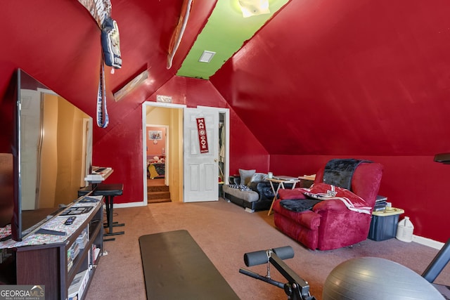 carpeted home theater featuring lofted ceiling