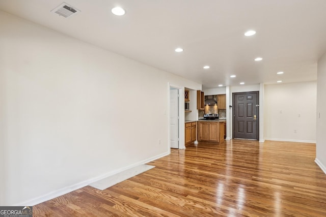 unfurnished living room with light hardwood / wood-style floors