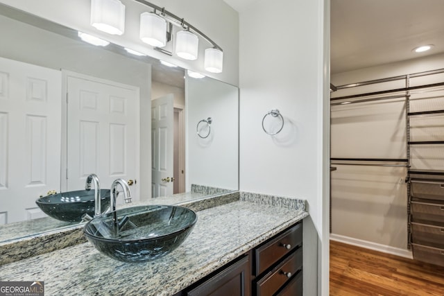 bathroom with wood-type flooring and vanity