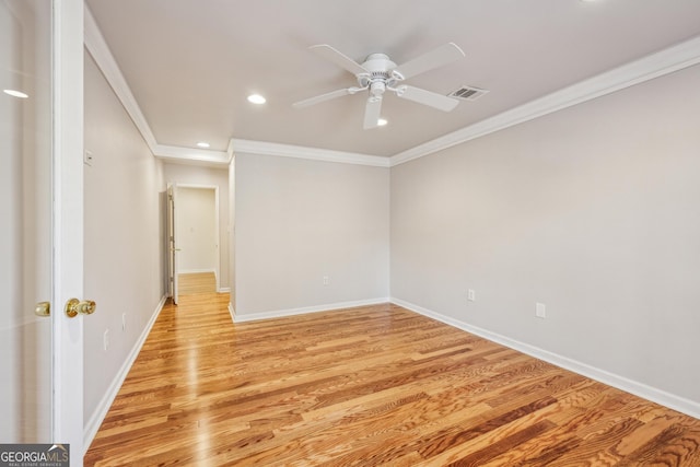 unfurnished room with crown molding, ceiling fan, and light wood-type flooring