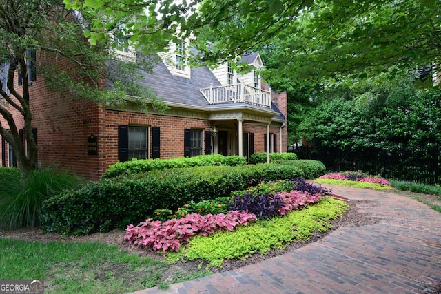 view of side of property featuring a balcony