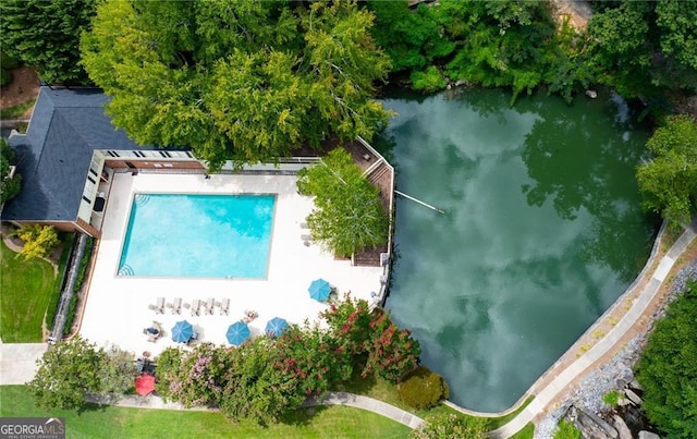 birds eye view of property featuring a water view