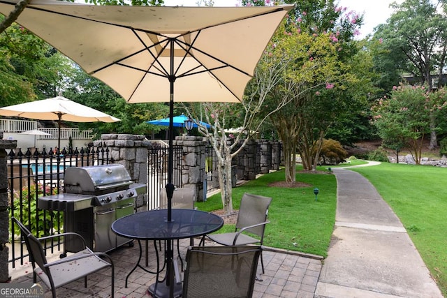 view of patio featuring a grill