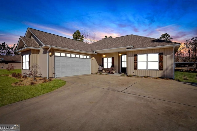 ranch-style home featuring a garage