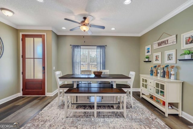 dining area featuring crown molding, dark hardwood / wood-style floors, and a textured ceiling