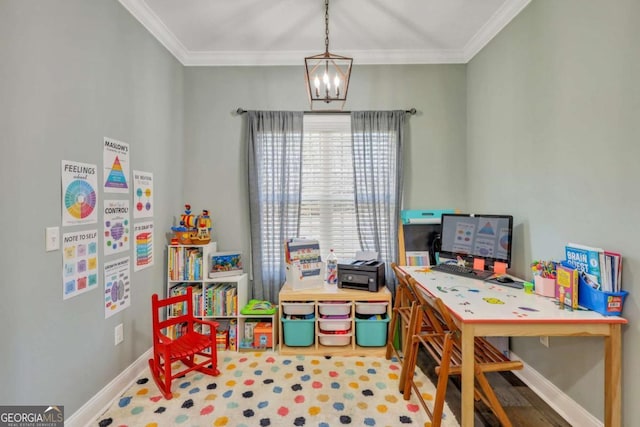 playroom with ornamental molding and a chandelier