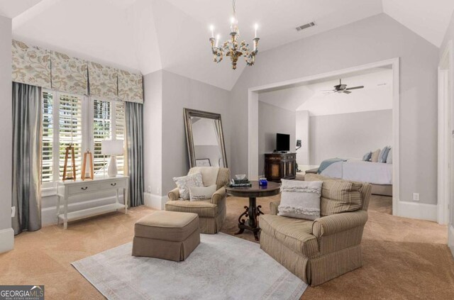 living room with vaulted ceiling, light carpet, and a notable chandelier