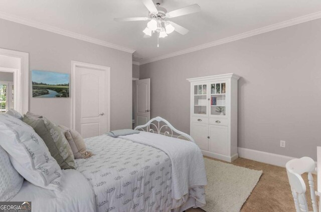 bedroom featuring crown molding, ceiling fan, and light carpet