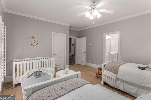 carpeted bedroom featuring ceiling fan and ornamental molding