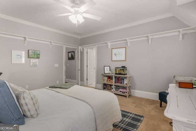 carpeted bedroom with crown molding and ceiling fan