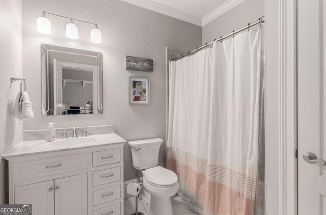 bathroom featuring vanity, a shower with curtain, ornamental molding, and toilet