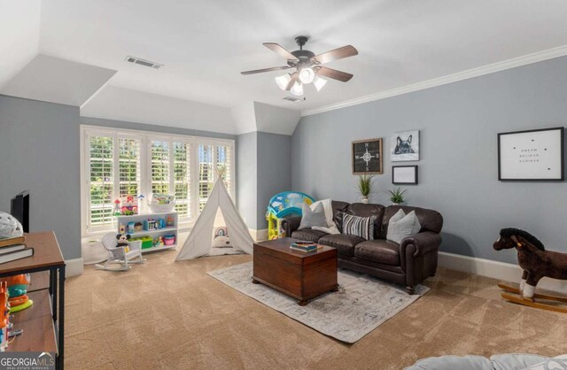 living room featuring crown molding, light colored carpet, and ceiling fan