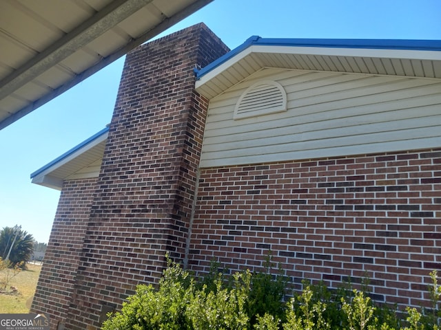 view of home's exterior with brick siding