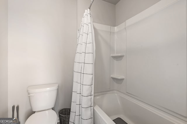 bathroom with shower / bath combination with curtain and toilet