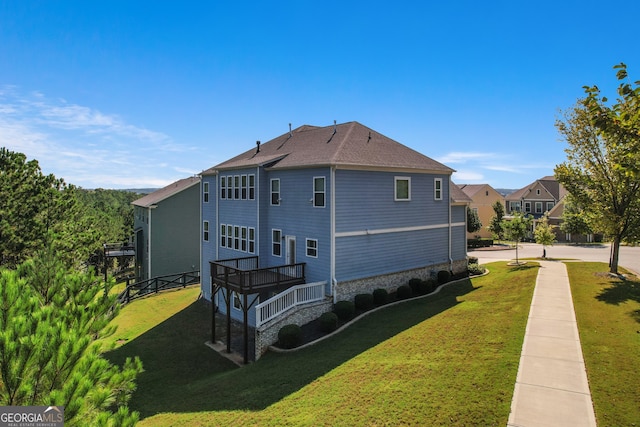 view of property exterior featuring a wooden deck and a yard