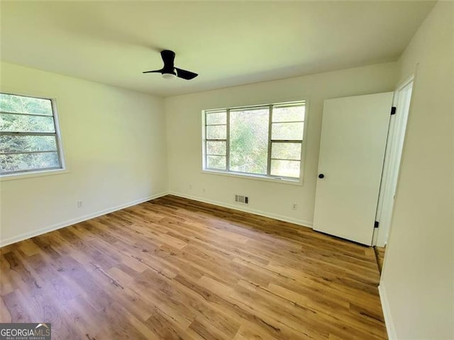 spare room featuring ceiling fan and light wood-type flooring