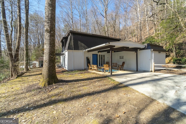 view of side of home featuring a patio area