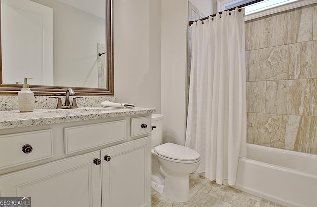 full bathroom featuring vanity, shower / bathtub combination with curtain, and toilet