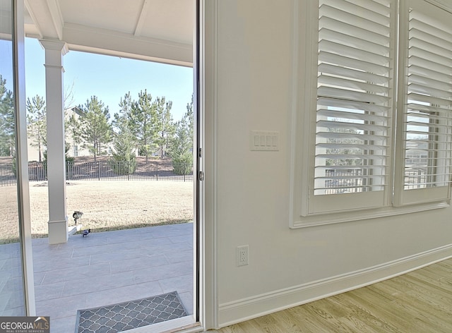 entryway with hardwood / wood-style flooring