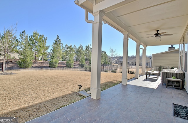 view of patio with outdoor lounge area and ceiling fan