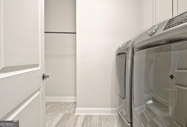 laundry area with washing machine and clothes dryer